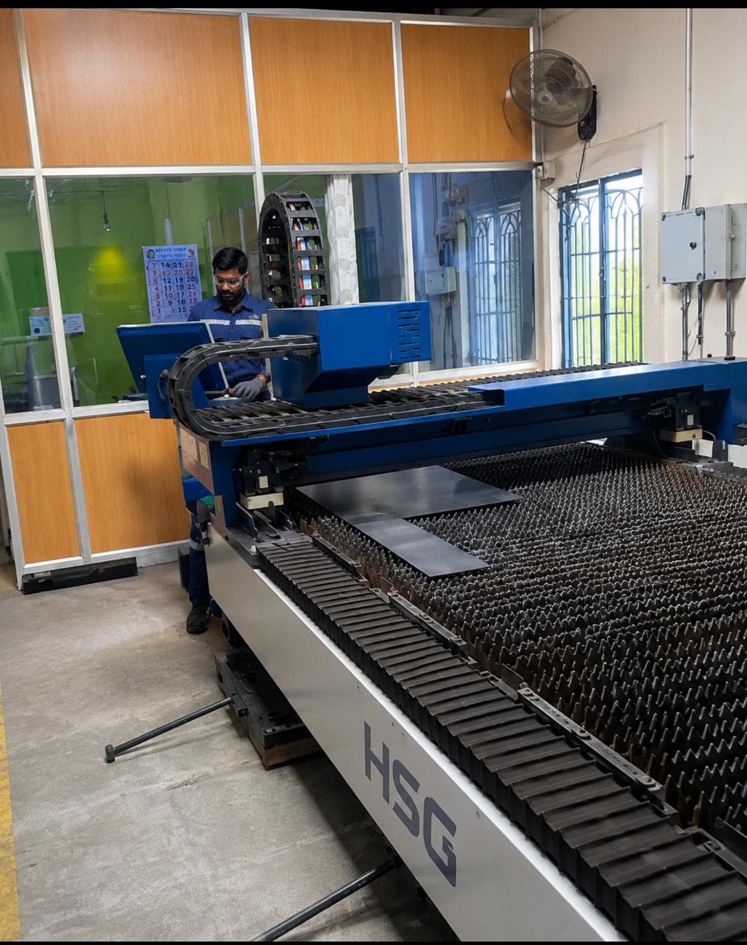 CNC fiber laser cutting operation